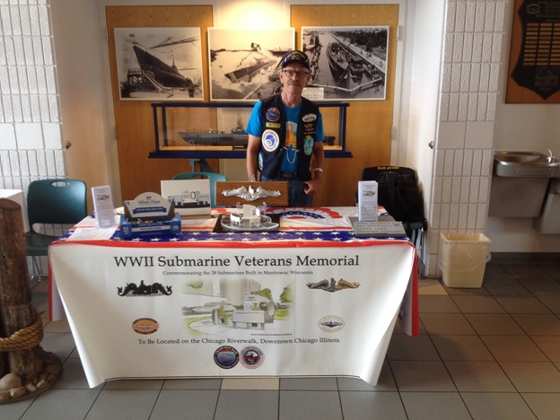 Greg Miller setting up in the Wisconsin Maritime Museum with donations going towards the WWII Submarine Veterans Memorial